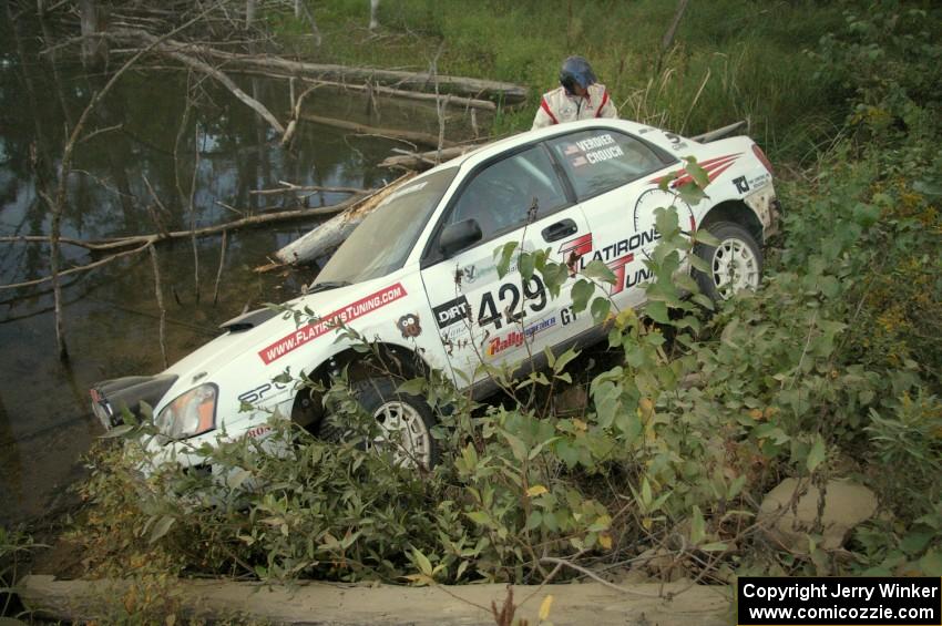 Stephan Verdier / Scott Crouch put their Subaru WRX off the road and onto a rockpile on SS15 ending their day.