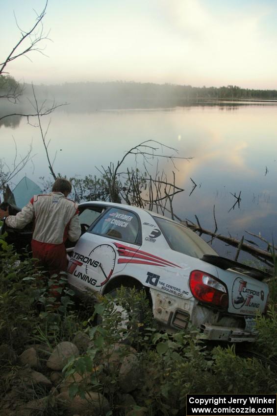 Stephan Verdier / Scott Crouch put their Subaru WRX off the road and onto a rockpile near the shore of McKenzie Lake on SS15.