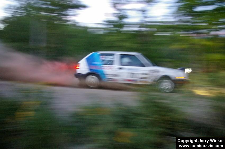 Chris Duplessis / Martin Headland VW GTI at speed on SS15 just after sundown.