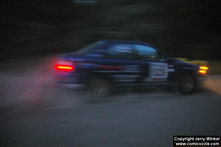 Travis Hanson / Terry Hanson Subaru Impreza WRX at speed on SS15 after sundown.