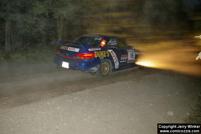 Kazimierz Pudelek / Mariusz Malik Subaru Impreza crawls through the dust on SS15.