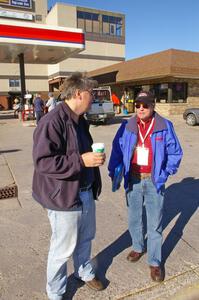 J.B. Niday and Mark Williams have a curbside chat outside of the headquarters the morning before LSPR.