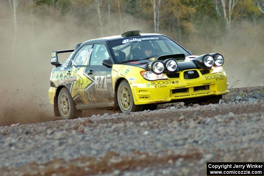 Tanner Foust / Chrissie Beavis Subaru WRX on the practice stage (1).