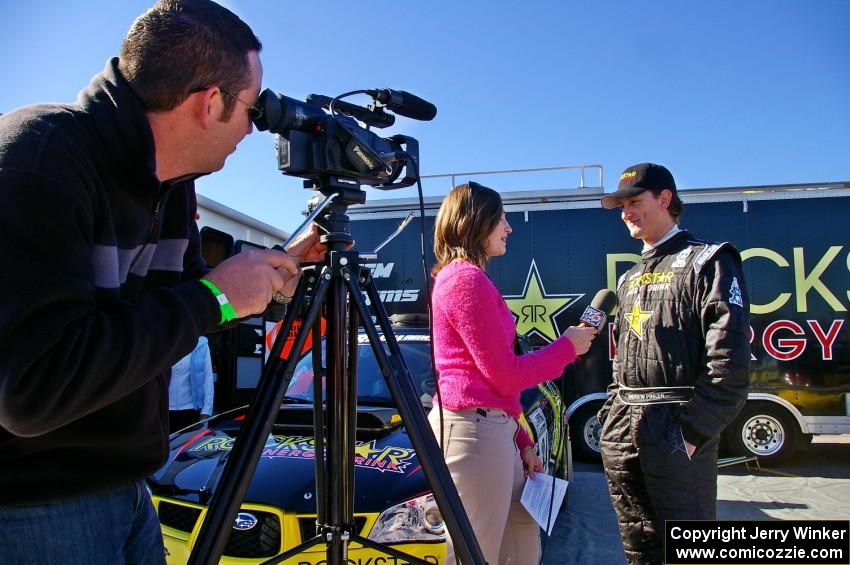 Andy Pinker gets interviewed prior to the start of the rally.