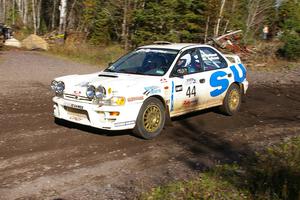 Henry Krolikowski / Cindy Krolikowski Subaru WRX at a sharp corner on SS1.