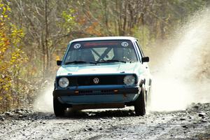 Tom Burress / Don Burress VW Rabbit hits a puddle on SS1.