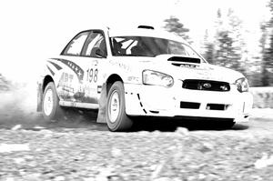 Arkadiusz Gruszka / Grzegorz Dorman in their Subaru WRX STi on SS1.