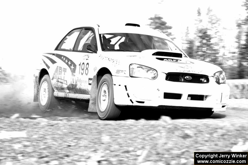 Arkadiusz Gruszka / Grzegorz Dorman in their Subaru WRX STi on SS1.