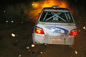 Arkadiusz Gruszka / Grzegorz Dorman in their Subaru WRX STi on the final corner of Echo Lake 1, SS4.