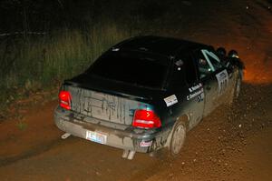 Chris Greenhouse / Matt Nichols Dodge Neon on slings rocks on the final corner of Echo Lake 1, SS4.