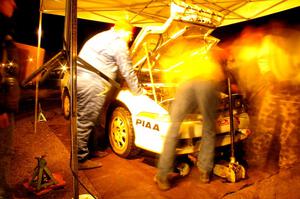 The crew of the Chris Czyzio / Jeff Secor Mitsubishi Eclipse GSX tears into the engine during Kenton service #1.