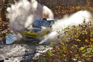 Tanner Foust / Chrissie Beavis Subaru WRX hits a puddle near the end of Gratiot Lake 1, SS9.