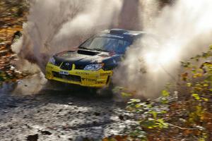 Andy Pinker / Robbie Durant Subaru Impreza WRX blasts through a large puddle on Gratiot Lake 1, SS9.