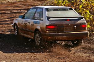 Erik Zenz / Dave Parps Mazda 323GTX through the final corner of Gratiot Lake 1, SS9. They DNF'ed later that day.