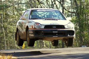 Matthew Johnson / Jeremy Wimpey Subaru WRX gets decent air over the midpoint jump on Brockway Mountain, SS13.