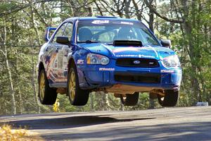 Kenny Bartram / Dennis Hotson Subaru WRX gets big air over the midpoint jump on Brockway Mountain, SS13.