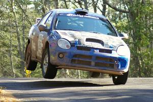 Cary Kendall / Scott Friberg Dodge SRT-4 comes down on the left-front after catching mild air on Brockway Mountain.