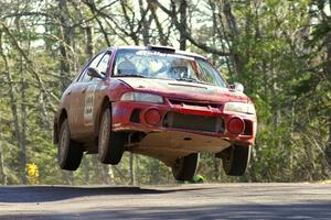 Dennis Martin / Kim DeMotte Mitsubishi Lancer Evo 4 gets major air over the midpoint jump on Brockway Mountain, SS13.