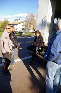 Matthew Johnson, unknown, Chrissie Beavis and Al Kintigh congregate at the back of the Rally-America scoring truck.