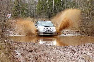 The O car of Tom Nelson hits a puddle near the finish of Gratiot Lake 2, SS16, at speed.