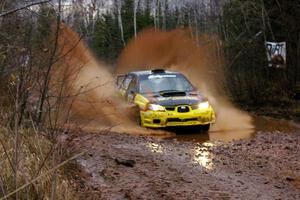 Tanner Foust / Chrissie Beavis Subaru WRX through the final puddle on Gratiot Lake 2, SS16.