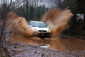 Matthew Johnson / Jeremy Wimpey Subaru WRX hits the final big puddle near the end of Gratiot Lake 2, SS16.