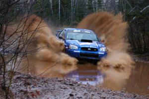 Kenny Bartram / Dennis Hotson Subaru WRX splashes in a big way at the final big puddle on Gratiot Lake 2, SS16.