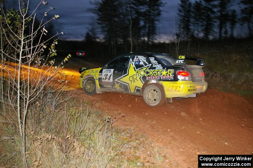 Tanner Foust / Chrissie Beavis Subaru WRX on rockets through the final corner of Echo Lake 1, SS4.