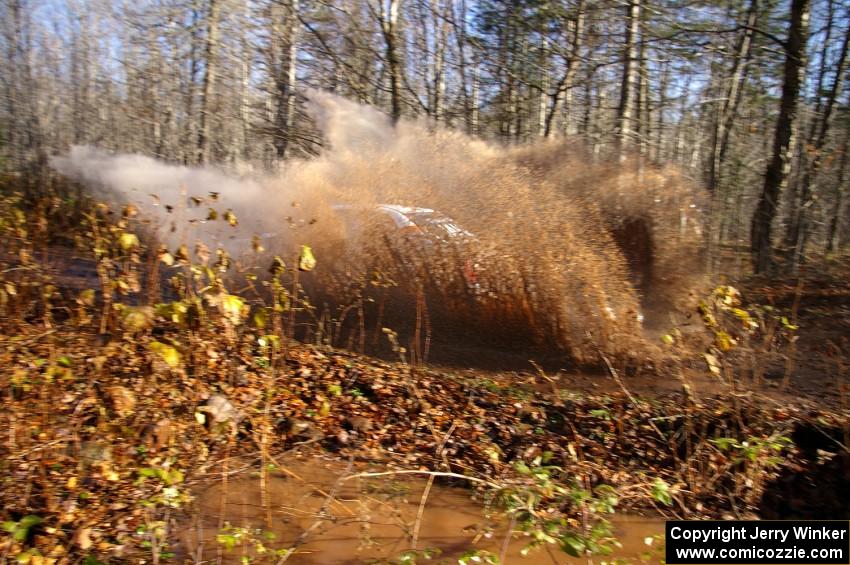 Matthew Johnson / Jeremy Wimpey Subaru WRX hits a large puddle near the end of Gratiot Lake 1, SS9.