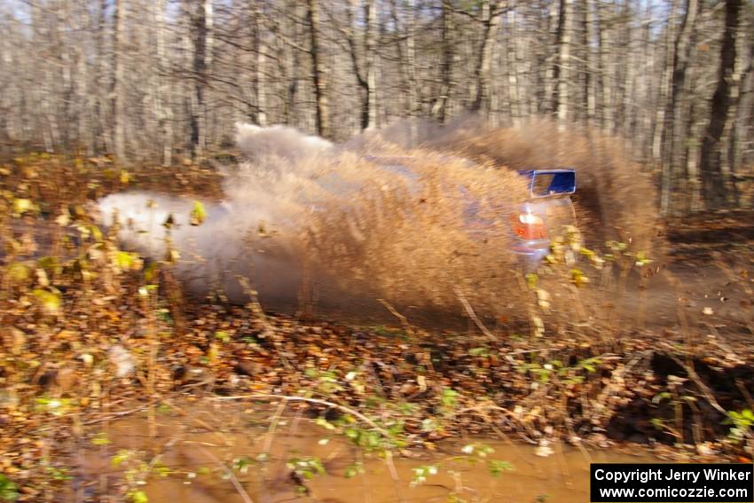 Kenny Bartram / Dennis Hotson Subaru WRX hits a puddle at speed on Gratiot Lake 1, SS9.