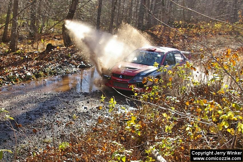 Andrew Comrie-Picard / Marc Goldfarb Mitsubishi Lancer Evo 9 hits the puddle near the end of Gratiot Lake 1, SS9.