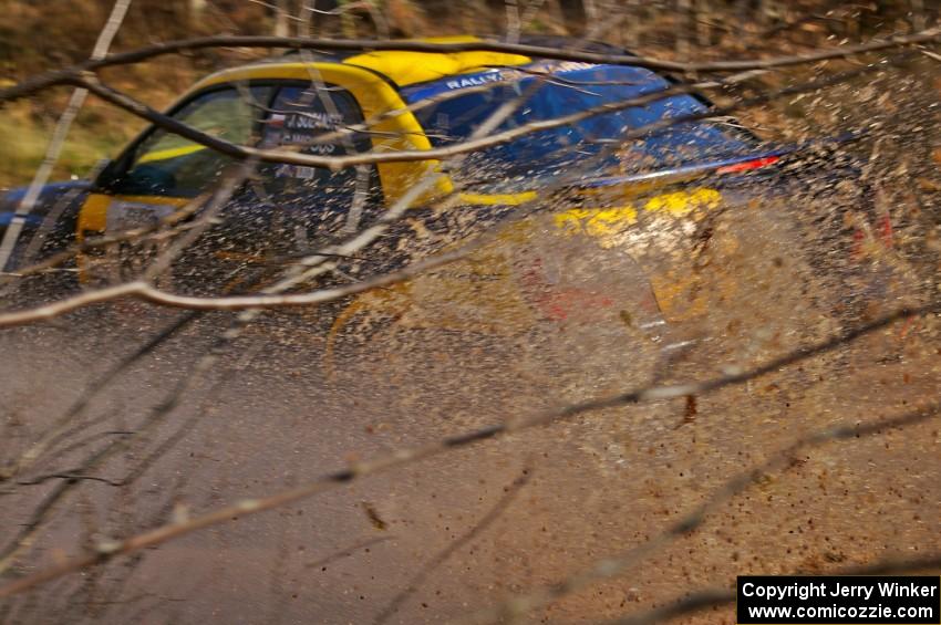 Jaroslaw Sozanski / Catherine Woods Subaru WRX hit a puddle at speed on Gratiot Lake 1, SS9.