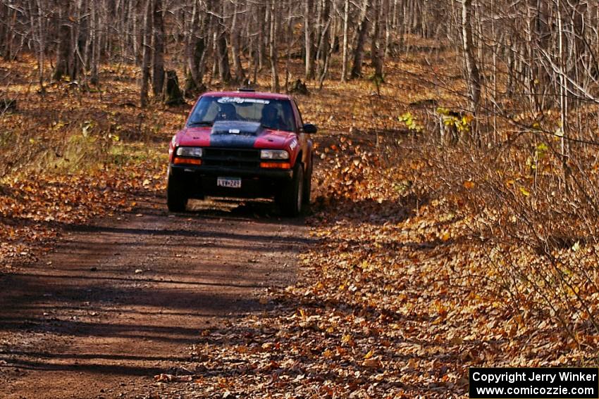 Jim Cox / Brent Carlson come down the final straight on Gratiot Lake 1, SS9, in their Chevy S-10.