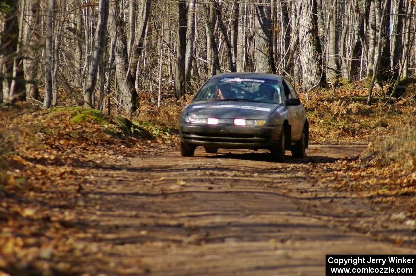 Dan Adamson / Chris Gordon Saturn SL2 at the finish of Gratiot Lake 1, SS9.