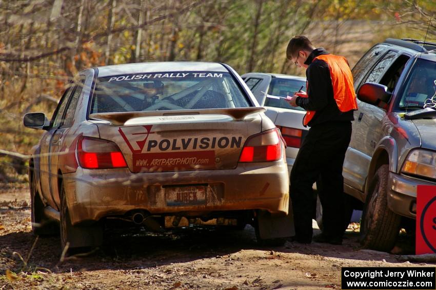 Yurek Cienkosz / Mariusz Malik Subaru WRX checks into the finish control of Gratiot Lake 1, SS9.