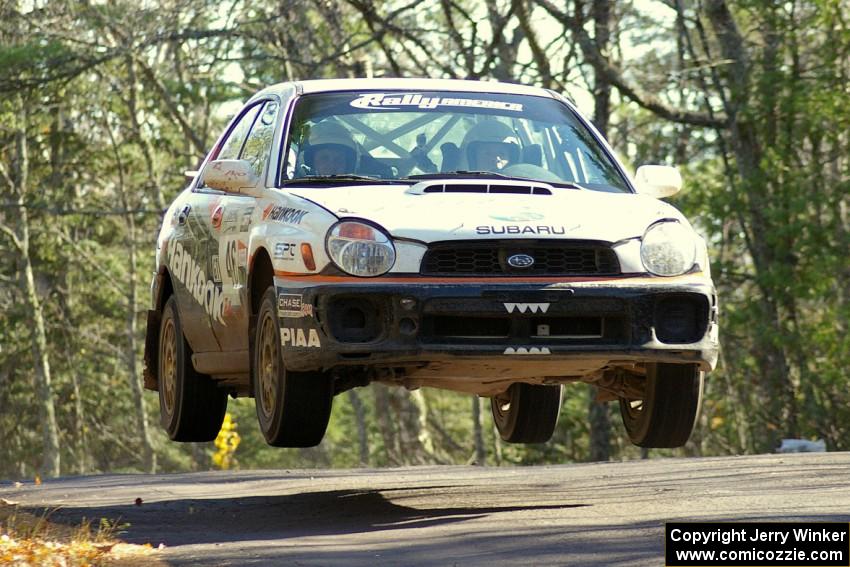 Matthew Johnson / Jeremy Wimpey Subaru WRX gets decent air over the midpoint jump on Brockway Mountain, SS13.