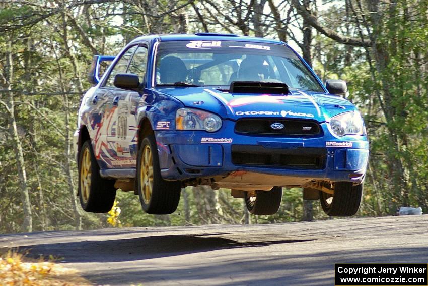 Kenny Bartram / Dennis Hotson Subaru WRX gets big air over the midpoint jump on Brockway Mountain, SS13.