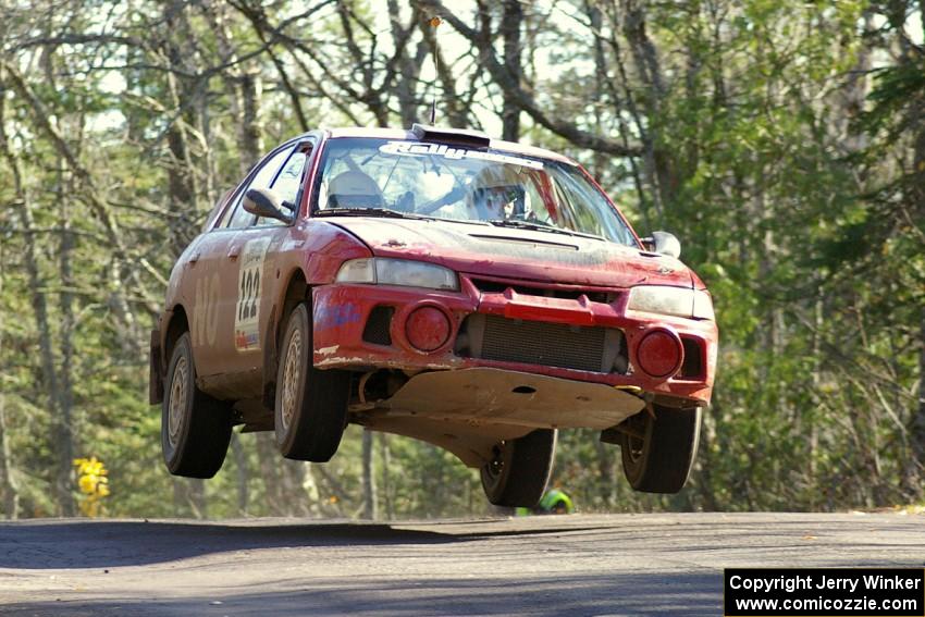 Dennis Martin / Kim DeMotte Mitsubishi Lancer Evo 4 gets major air over the midpoint jump on Brockway Mountain, SS13.