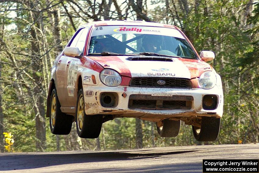 Justin Pritchard / Bill Westrick Subaru WRX catch air on the midpoint jump on Brockway Mountain, SS13.