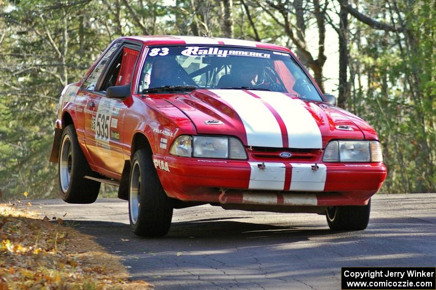 Mark Utecht / Rob Bohn Ford Mustang at the midpoint jump on Brockway Mountain, SS13.