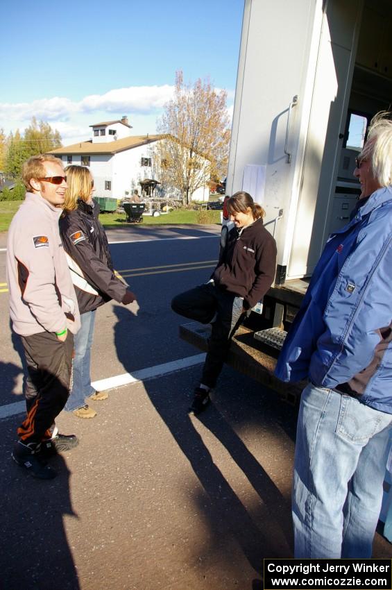 Matthew Johnson, unknown, Chrissie Beavis and Al Kintigh congregate at the back of the Rally-America scoring truck.