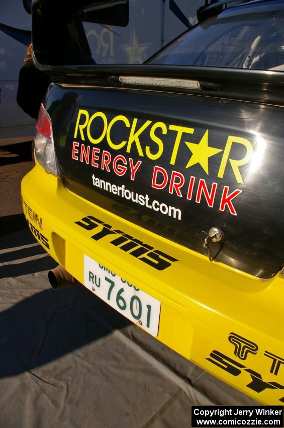 Tanner Foust / Chrissie Beavis Subaru WRX idles on the jack stands at Copper Harbor service.