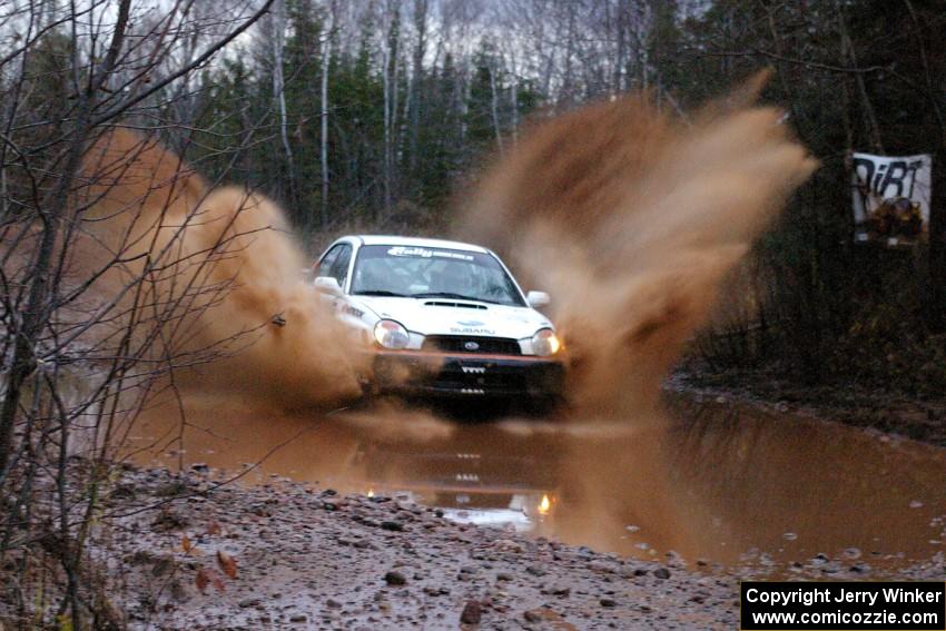 Matthew Johnson / Jeremy Wimpey Subaru WRX hits the final big puddle near the end of Gratiot Lake 2, SS16.
