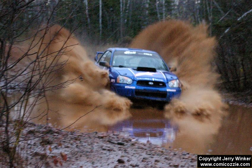 Kenny Bartram / Dennis Hotson Subaru WRX splashes in a big way at the final big puddle on Gratiot Lake 2, SS16.