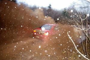 Amy BeberVanzo / Alex Kihurani Mitsubishi Lancer Evo 8 through the final puddle on Gratiot Lake 2, SS16.