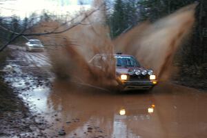 Matt Bushore / Andy Bushore VW Jetta hits the final puddle while transiting on Gratiot Lake 2, SS16.