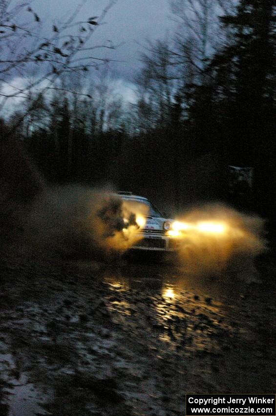 Henry Krolikowski / Cindy Krolikowski Subaru WRX hits the final big puddle on Gratiot Lake 2, SS16.