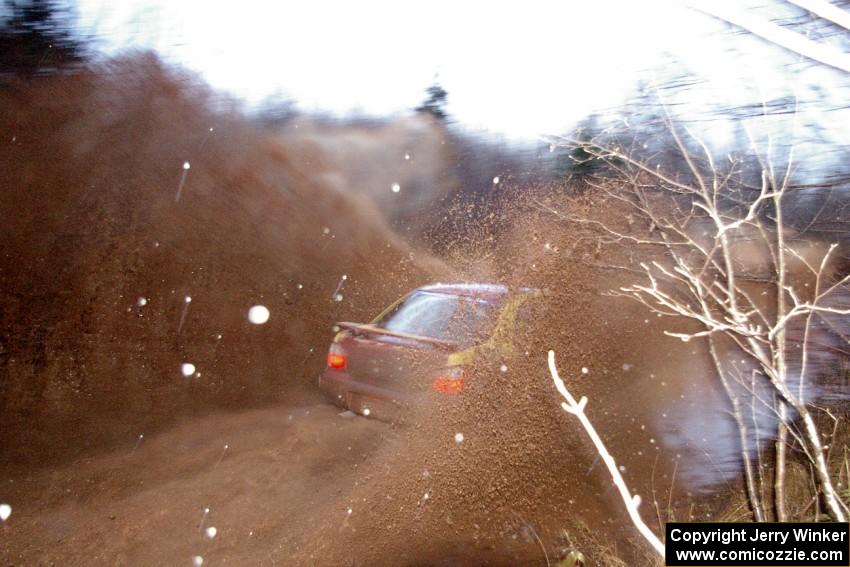 Bryan Pepp / Jerry Stang Subaru WRX at speed through the final puddle on Gratiot Lake 2, SS16.