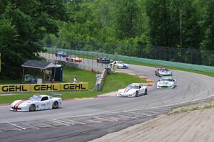 Front end of the field comes through Canada Corner on the pace lap.