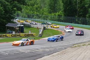 Mid-section of the field comes through Canada Corner on the pace lap.